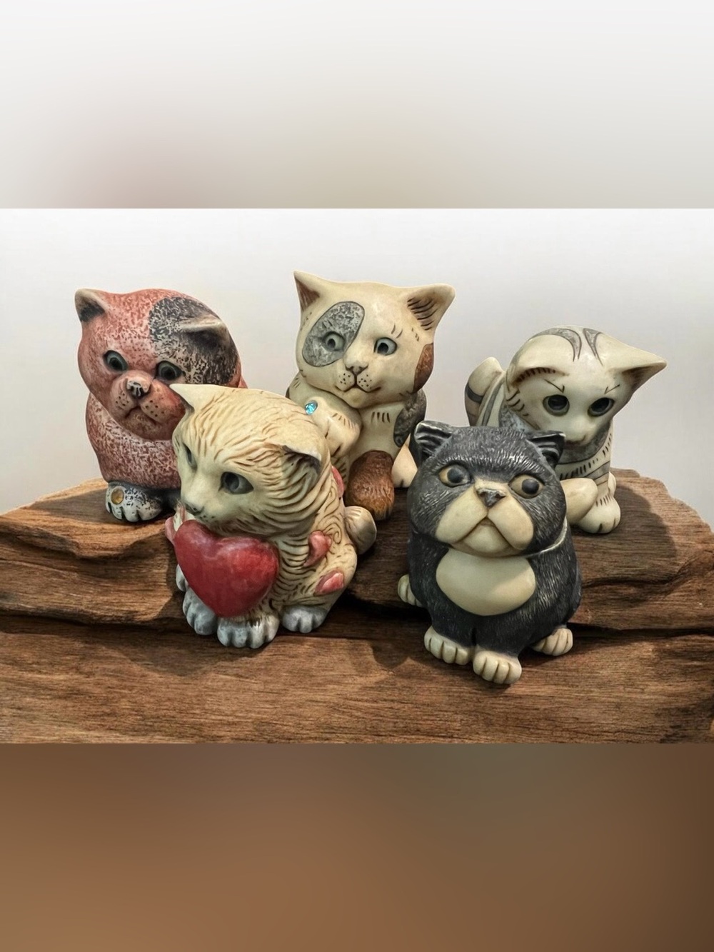 A collection of five 2002 Harmony Kingdom Pot Belly cat figurines.